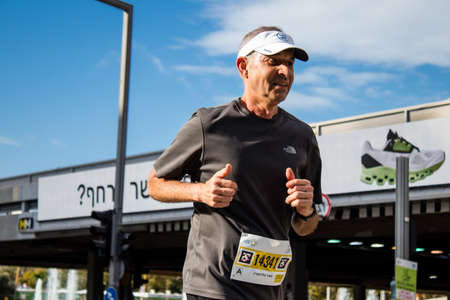 Tel Aviv, Israel - February 25, 2022 Runners in the street of Tel Aviv at the Samsung Marathon which takes place on February 25 after a year-long hiatus following the coronavirus outbreak in Israelのeditorial素材