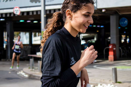 Tel Aviv, Israel - February 25, 2022 Runners in the street of Tel Aviv at the Samsung Marathon which takes place on February 25 after a year-long hiatus following the coronavirus outbreak in Israelのeditorial素材