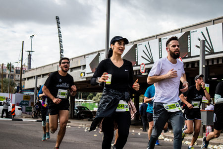 Tel Aviv, Israel - February 25, 2022 Runners in the street of Tel Aviv at the Samsung Marathon which takes place on February 25 after a year-long hiatus following the coronavirus outbreak in Israelのeditorial素材