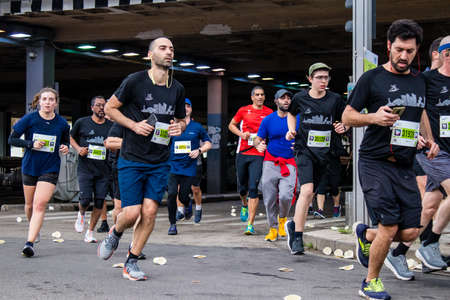 Tel Aviv, Israel - February 25, 2022 Runners in the street of Tel Aviv at the Samsung Marathon which takes place on February 25 after a year-long hiatus following the coronavirus outbreak in Israelのeditorial素材