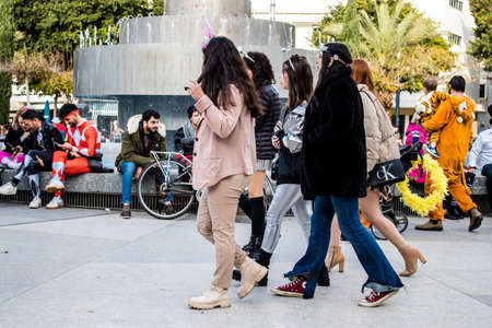 Tel Aviv, Israel - March 18, 2022 Israeli people at Dizengoff square dressed with costumes for the...