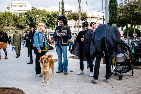 Tel Aviv, Israel - March 18, 2022 Israeli people at Dizengoff square dressed with costumes for the Purim carnival celebration which takes place on March in Israel, Purim festival is a Jewish traditionのeditorial素材