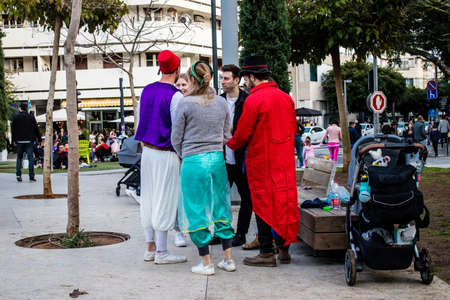 Tel Aviv, Israel - March 18, 2022 Israeli people at Dizengoff square dressed with costumes for the...