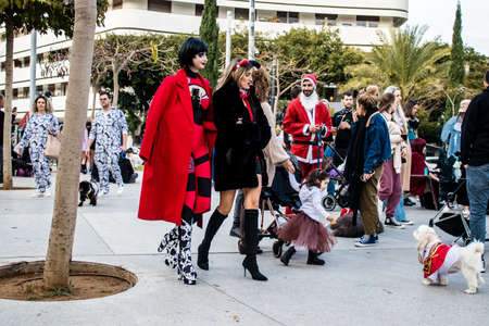 Tel Aviv, Israel - March 18, 2022 Israeli people at Dizengoff square dressed with costumes for the Purim carnival celebration which takes place on March in Israel, Purim festival is a Jewish traditionのeditorial素材