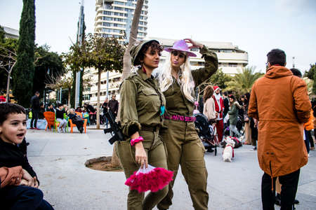 Tel Aviv, Israel - March 18, 2022 Israeli people at Dizengoff square dressed with costumes for the Purim carnival celebration which takes place on March in Israel, Purim festival is a Jewish traditionのeditorial素材