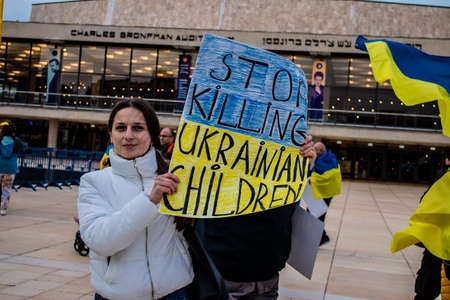 Tel Aviv, Israel - March 20, 2022 Protesters against Russian policy towards Ukraine in Habima Square...