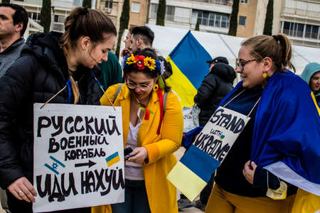 Tel Aviv, Israel - March 20, 2022 Protesters against Russian policy towards Ukraine in Habima Square...