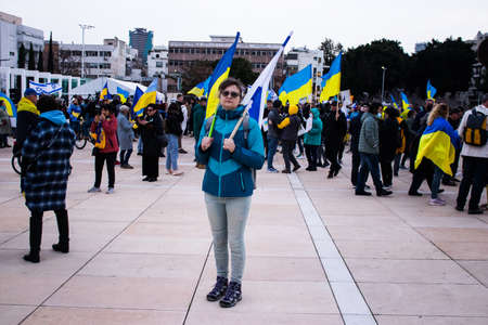 Tel Aviv, Israel - March 20, 2022 Protesters against Russian policy towards Ukraine in Habima Square...