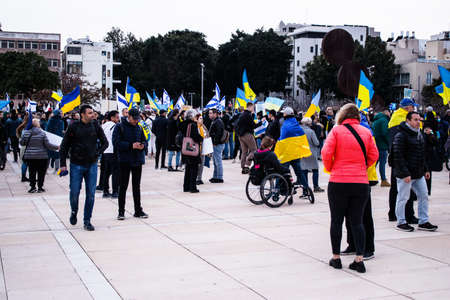 Tel Aviv, Israel - March 20, 2022 Protesters against Russian policy towards Ukraine in Habima Square...
