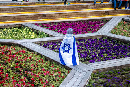 Tel Aviv, Israel - March 20, 2022 Protesters against Russian policy towards Ukraine in Habima Square...