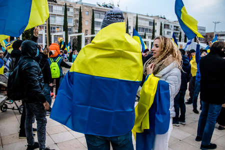 Tel Aviv, Israel - March 20, 2022 Protesters against Russian policy towards Ukraine in Habima Square...