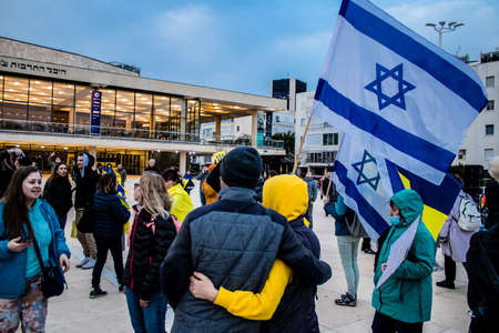 Tel Aviv, Israel - March 20, 2022 Protesters against Russian policy towards Ukraine in Habima Square...