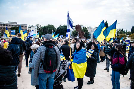 Tel Aviv, Israel - March 20, 2022 Protesters against Russian policy towards Ukraine in Habima Square...
