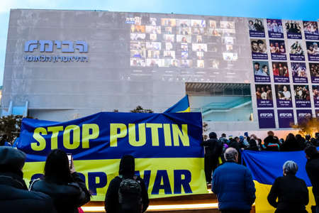 Tel Aviv, Israel - March 20, 2022 Protesters against Russian policy towards Ukraine in Habima Square...