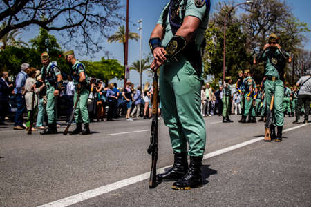 Seville, Spain - May 01, 2022 Parade of professional soldiers from the Spanish Legion, this military unit of the Spanish Army parade through the streets of Seville for the launch of the Feriaの写真素材