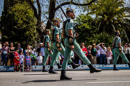 Seville, Spain - May 01, 2022 Parade of professional soldiers from the Spanish Legion, this military...