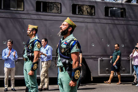 Seville, Spain - May 01, 2022 Parade of professional soldiers from the Spanish Legion, this military unit of the Spanish Army parade through the streets of Seville for the launch of the Feriaのeditorial素材