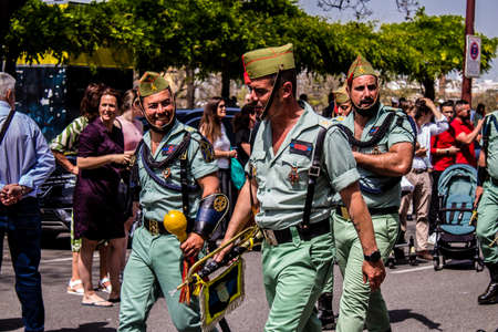 Seville, Spain - May 01, 2022 Parade of professional soldiers from the Spanish Legion, this military...
