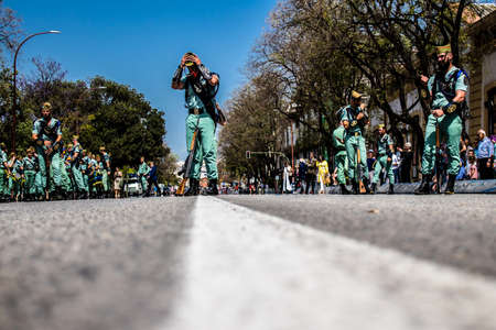 Seville, Spain - May 01, 2022 Parade of professional soldiers from the Spanish Legion, this military unit of the Spanish Army parade through the streets of Seville for the launch of the Feriaのeditorial素材