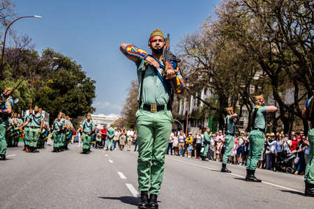 Seville, Spain - May 01, 2022 Parade of professional soldiers from the Spanish Legion, this military unit of the Spanish Army parade through the streets of Seville for the launch of the Feriaのeditorial素材
