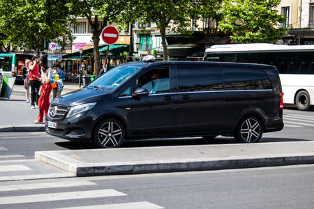 Paris, France - May 21, 2022 Taxi driving through the streets of Paris during the coronavirus outbreak hitting France, wearing a mask is mandatoryのeditorial素材