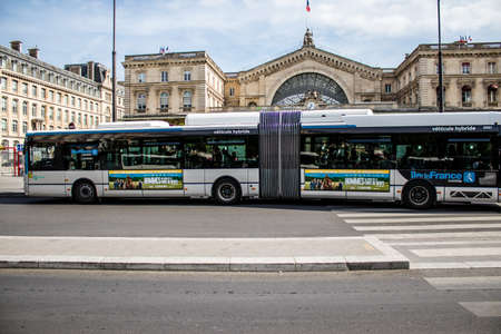 Paris, France - May 21, 2022 Bus driving through the streets of Paris during the coronavirus outbreak hitting France, wearing a mask is mandatoryのeditorial素材