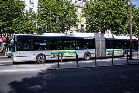Paris, France - May 21, 2022 Bus driving through the streets of Paris during the coronavirus outbreak hitting France, wearing a mask is mandatoryのeditorial素材