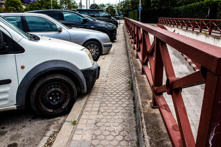 Seville, Spain - May 21, 2022 Cars parked in the streets of Seville, an emblematic city and the capital of the region of Andalusia, in the south of Spainのeditorial素材
