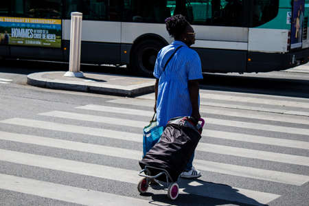 Paris, France - May 21, 2022 Tourists walking in the streets of Paris near the train station during the coronavirus outbreak hitting France, wearing a mask is not mandatoryのeditorial素材
