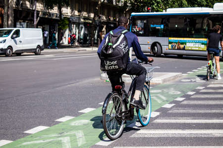 Paris, France - May 21, 2022 People rolling with a bicycle in the streets of Paris during the...