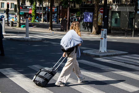 Paris, France - May 21, 2022 Tourists walking in the streets of Paris near the train station during the coronavirus outbreak hitting France, wearing a mask is not mandatoryのeditorial素材