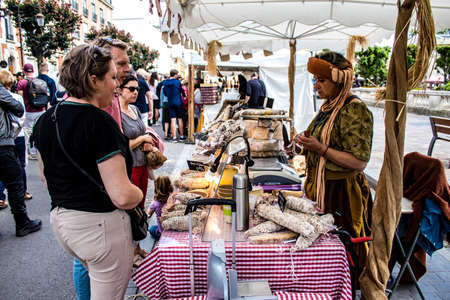 Reims, France - May 28, 2022 Artisan stall selling their wares at the medieval market during the Johanniques festivities, back after a two year hiatus following coronavirus outbreakのeditorial素材