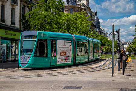 Reims, France - May 25, 2022 Modern electric tram for passengers rolling through the streets of Reims during the coronavirus outbreak hitting France, wearing a mask is mandatoryのeditorial素材