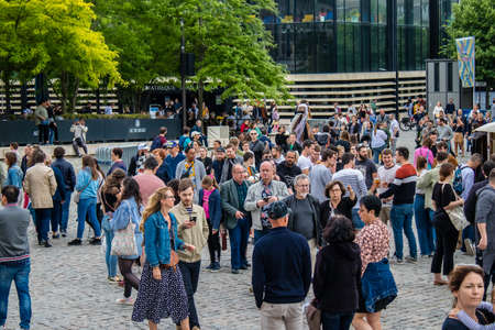 Reims, France - May 28, 2022 Visitors wandering the aisles of the medieval market during Johanniques festivities, this event is back after a two-year hiatus following the coronavirus outbreakのeditorial素材