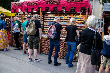 Reims, France - May 28, 2022 Visitors wandering the aisles of the medieval market during Johanniques...