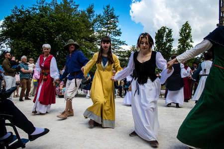 Reims, France - May 28, 2022 Musician of a Middle Ages music group performing at the Johanniques festivities, this event is back after a two-year hiatus following the outbreak of coronavirusのeditorial素材