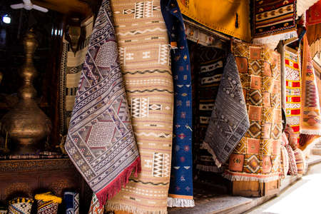 Fez, Morocco - June 12, 2022 The souks of Fez located in the medina are traditional Arab markets that offer all kinds of products like fabrics, food products, makeup and household appliancesの写真素材