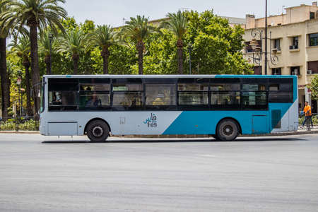 Fez, Morocco - June 14, 2022 Bus driving through the streets of Fez during the coronavirus outbreak hitting Morocco, wearing a mask is mandatoryのeditorial素材