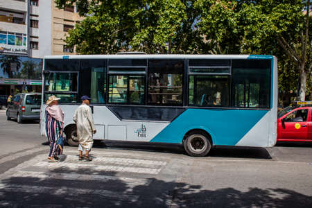 Fez, Morocco - June 14, 2022 Bus driving through the streets of Fez during the coronavirus outbreak hitting Morocco, wearing a mask is mandatoryのeditorial素材