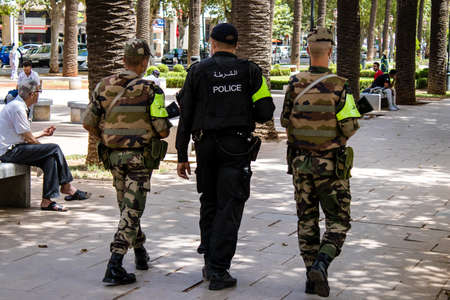 Fez, Morocco - June 14, 2022 Police patrolling in the streets of Fez during the coronavirus outbreak hitting Morocco, wearing a mask is mandatoryのeditorial素材
