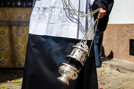 Carmona, Spain - June 19, 2022 Corpus Christi of Carmona, religious procession through the streets to Santa Maria Church, made up of religious statues, young children, christians and a music bandのeditorial素材