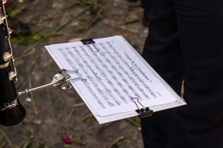 Carmona, Spain - June 19, 2022 Corpus Christi of Carmona, religious procession through the streets to Santa Maria Church, made up of religious statues, young children, christians and a music bandのeditorial素材