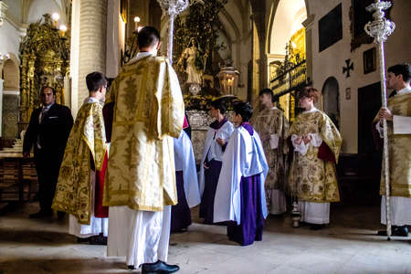 Carmona, Spain - June 18, 2022 Corpus Christi of Carmona, Religious procession in the streets, transfer from San Blas church of the Virgen of the Rosary to Santa Maria church, people pray in the wayのeditorial素材