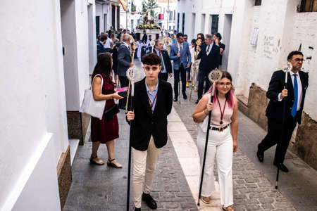 Carmona, Spain - June 18, 2022 Corpus Christi of Carmona, Religious procession in the streets, transfer from San Blas church of the Virgen of the Rosary to Santa Maria church, people pray in the wayのeditorial素材