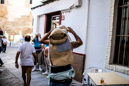 Carmona, Spain - June 18, 2022 Corpus Christi of Carmona, Religious procession in the streets, transfer from San Blas church of the Virgen of the Rosary to Santa Maria church, people pray in the wayのeditorial素材