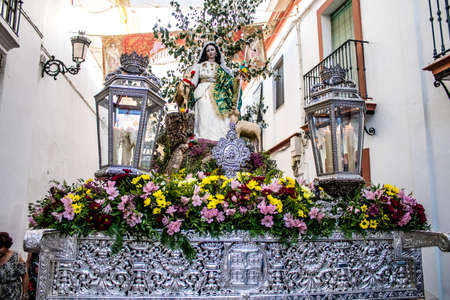 Carmona, Spain - June 18, 2022 Corpus Christi of Carmona, Religious procession in the streets, transfer from San Blas church of the Virgen of the Rosary to Santa Maria church, people pray in the wayのeditorial素材