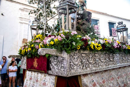 Carmona, Spain - June 18, 2022 Corpus Christi of Carmona, Religious procession in the streets, transfer from San Blas church of the Virgen of the Rosary to Santa Maria church, people pray in the wayのeditorial素材