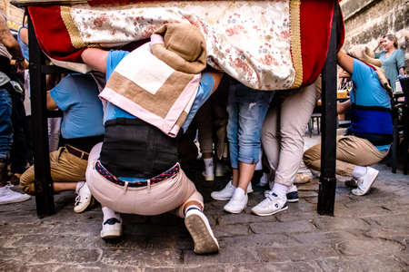 Carmona, Spain - June 18, 2022 Corpus Christi of Carmona, Religious procession in the streets, transfer from San Blas church of the Virgen of the Rosary to Santa Maria church, people pray in the wayのeditorial素材
