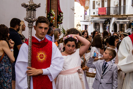 Carmona, Spain - June 19, 2022 Corpus Christi of Carmona, religious procession with young children...