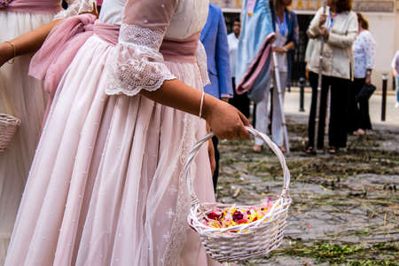 Carmona, Spain - June 19, 2022 Corpus Christi of Carmona, religious procession with young children walking through the streets to Santa Maria Churchのeditorial素材